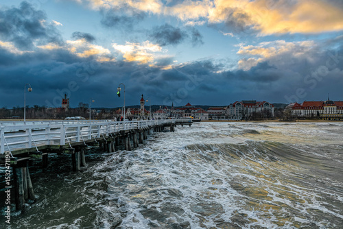 Fototapeta Naklejka Na Ścianę i Meble -  Beautiful old wooden pier and stormy sea waves