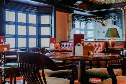 Cozy living room atmosphere inside English British pub bar lounge bistro onboard luxury cruiseship cruise ship ocean liner in contemporary Art Deco interior design