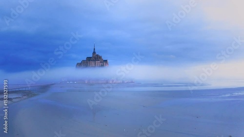 Mont Saint Michel abbey, France, on the blue misty morning