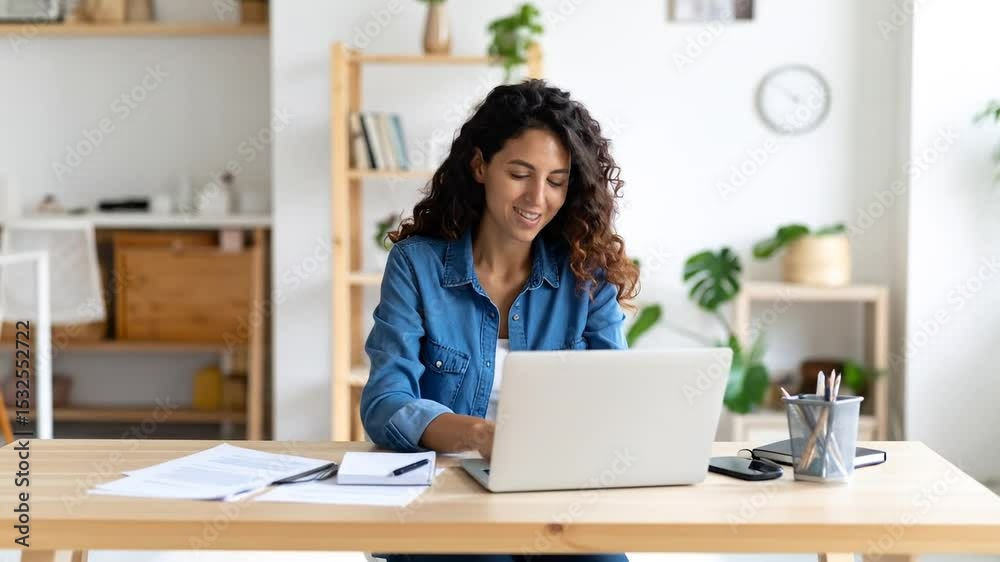 Woman Working On Laptop In Home Office Woman Working On Laptop In Home Office