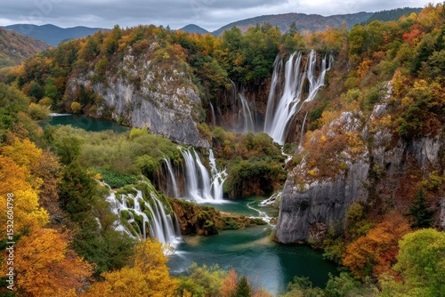Serene autumn waterfall landscape in a mountain valley