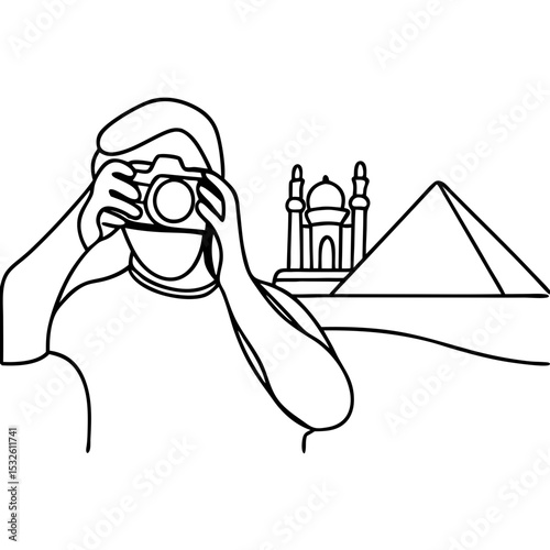 Tourist photographing iconic landmark in desert. Person takes picture of ancient pyramids and mosque.  Travel photography concept for brochures and travel guides.