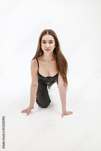 Girl on a white background in jeans.