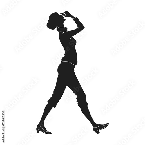 Silhouette of a woman walking and looking up