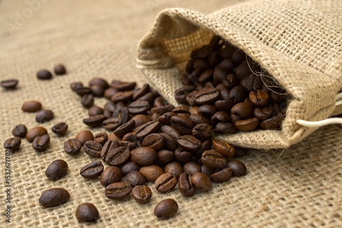 Roasted Coffee Beans Spilling from Burlap Sack onto Burlap Surface – Rustic Cafe or Packaging Mockup Scene.