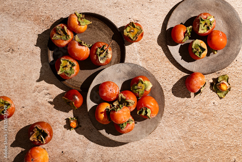 fresh persimmon in hard light