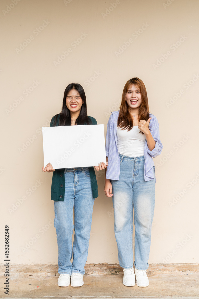 group of young lesbian couple holding a blank sign group of young lesbian couple holding a blank sign