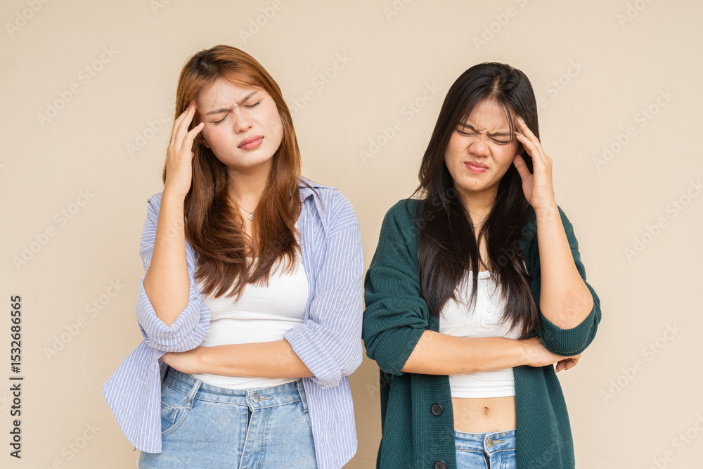 two teenage women having headache and stress two teenage women having headache and stress