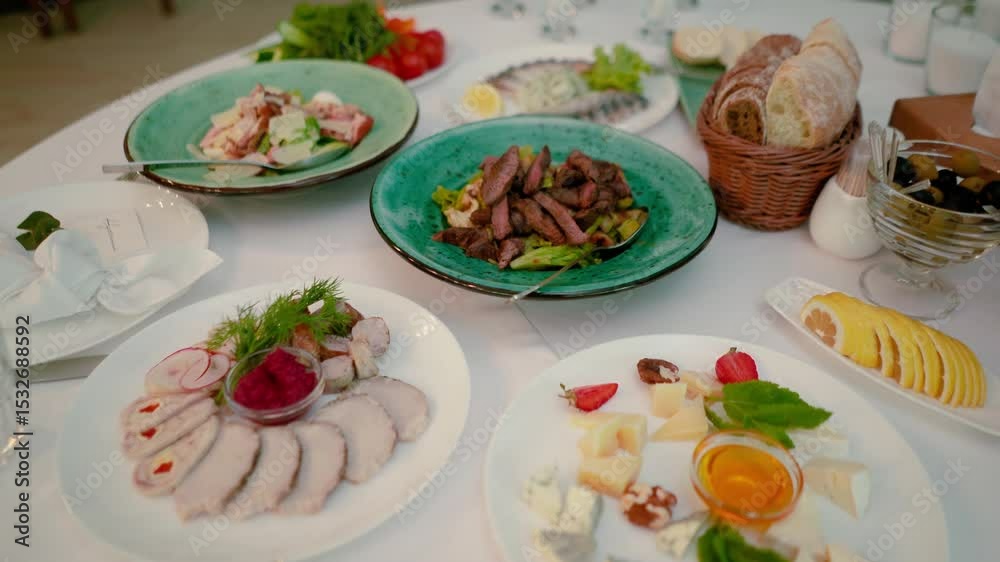 Catering service on banquet table with canape snacks in restaurant or hotel. Decorated food set on birthday, wedding celebration or business conference event venue. Catering service on banquet table with canape snacks in restaurant or hotel. Decorated food set on birthday, wedding celebration or business conference event venue.