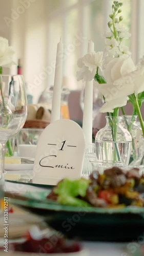 Catering service on banquet table with canape snacks in restaurant or hotel. Decorated food set on birthday, wedding celebration or business conference event venue.