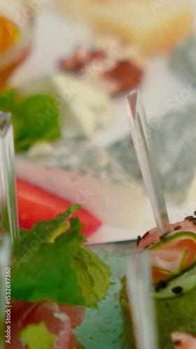 Catering service on banquet table with canape snacks in restaurant or hotel. Decorated food set on birthday, wedding celebration or business conference event venue.