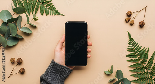 Young woman holding smartphone on balcony in the morning talking on phone photo
