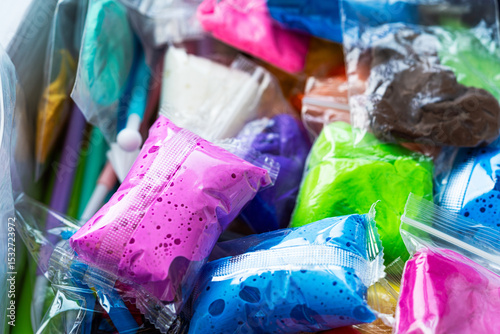 Bright packages of colorful air dry clay for children’s creativity and learning. Perfect for summer holidays, fun activities, and artistic development.
