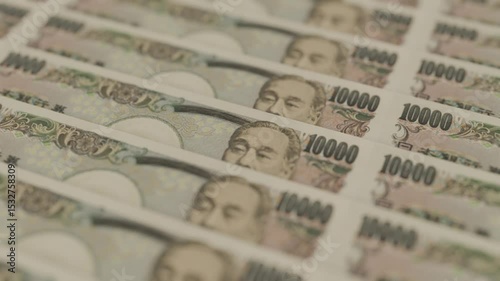 Japan yen money bank note row paper value exchange rate debt investment fund value saving cash interest inflation appreciation rise or depreciation concept.