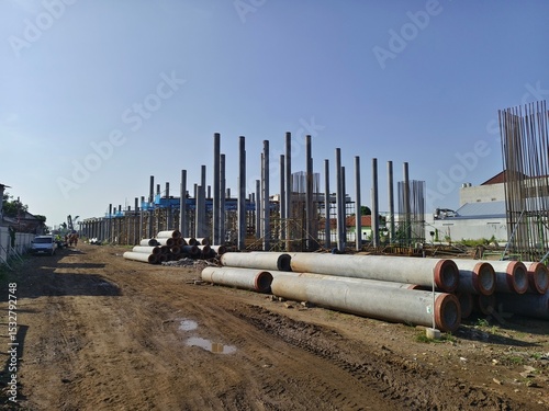 the line of pile foundations for the elevated toll road project. spun pile concrete foundation structure. access to project work.
