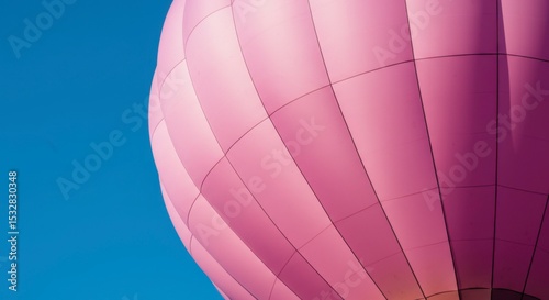 Pink hot air balloon against clear sky