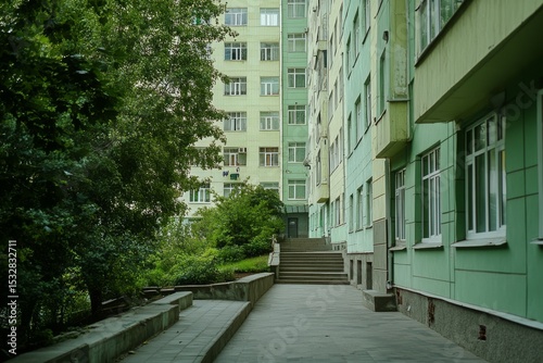a part of multistory building, green facade in spring photo