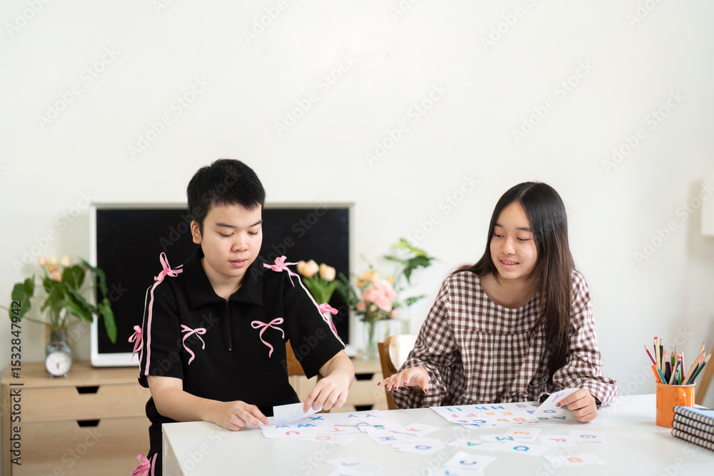 Fototapeta premium Back to School and Interactive Learning. Students sorting educational materials during a creative session.