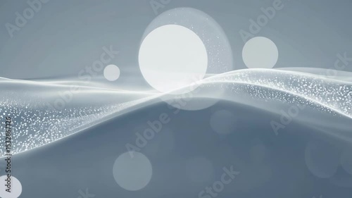 Elegant abstract animation shows flowing white particles and circular light elements moving gracefully across soft blue-gray background creating mesmerizing digital art display