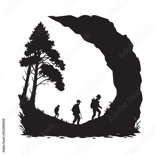 Silhouette of hikers walking past a rock formation