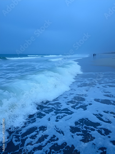 The ocean waves crashing on the shore tonight