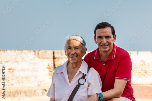 Adult son and his senior mother in Cartagena de Indias. Real family. Family love. Family travel concept.