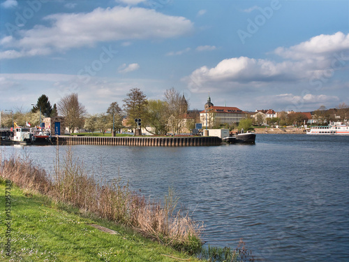 Beautiful view of the River Weser in Germany with the city of Hameln visible under a cloudy sky