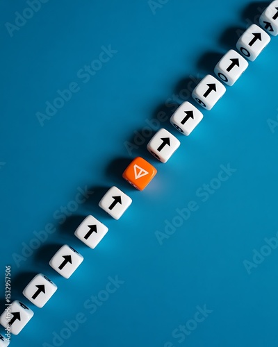 A diagonal line of white dice with upward arrows and one orange dice on a blue colored background