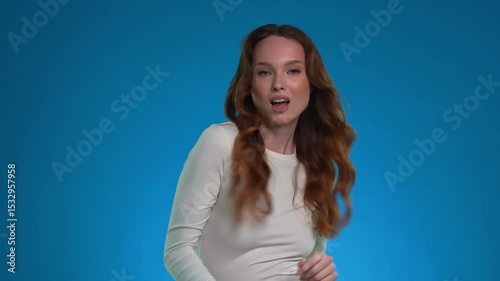 Emotional expression showcased by a woman in a studio setting