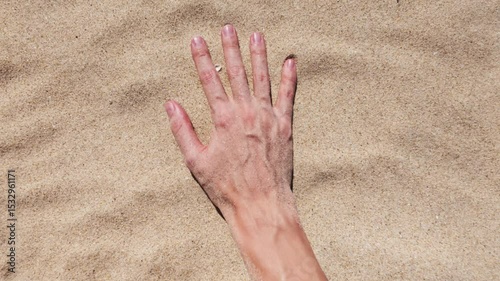 Background with hand movement on sand
