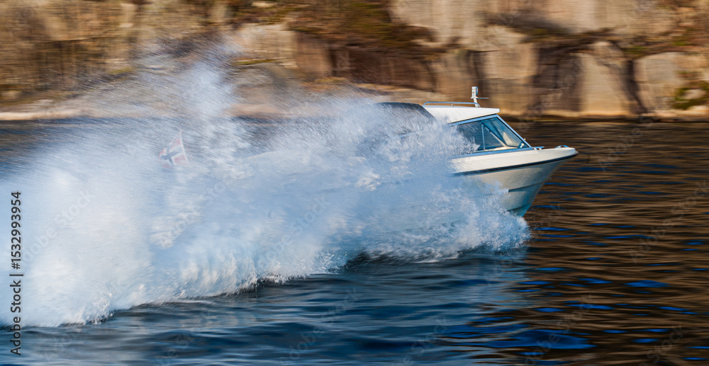 Fototapeta premium high-speed boat cutting through water with massive spray.