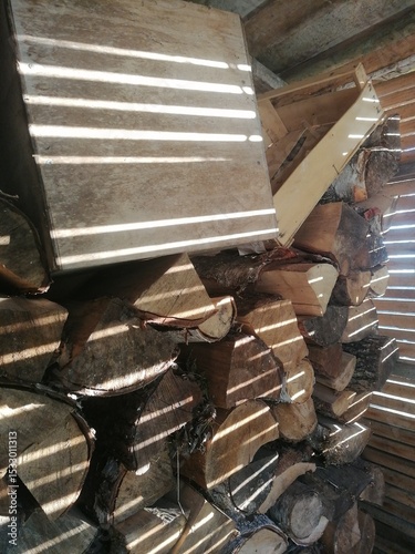 rustic wooden texture with sun shadows in woodshed