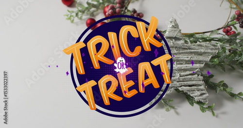 Displaying purple Trick or Treat sign on white tabletop, with wreath, berries and star ornament