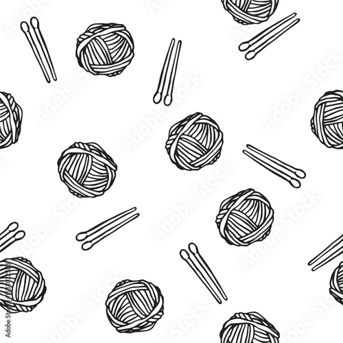 seamless pattern with balls of yarn and knitting needles. vector print in doodle style