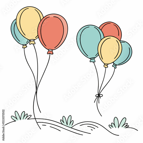 Colorful balloons floating in the air above grassy landscape  