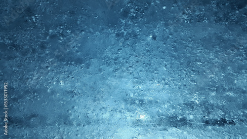 Abstract texture displaying a cold and icy blue with subtle surface variations throughout