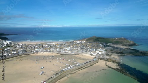St Ives, Cornwall, England: DRONE VIEWS: The drone circles St Ives harbour showing St Ives Head, Bamaluz beach, Porthgwidden beach and Porthmeor beach. St Ives is a popular UK holiday destination (2).