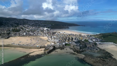 St Ives, Cornwall, England: DRONE VIEWS: The drone circles St Ives harbour showing St Ives Head, Bamaluz beach, Porthgwidden beach and Porthmeor beach. St Ives is a popular UK holiday destination (1).