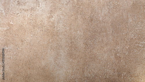 Textured concrete surface in earthy tones showing rough and imperfect details
