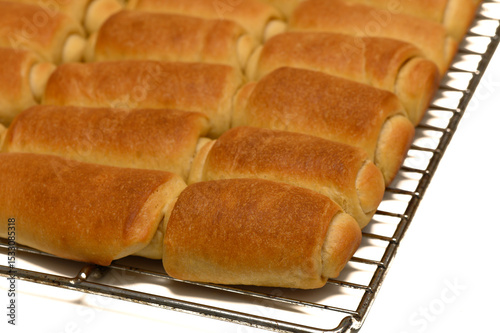 фотографія Fresh Parker House Rolls Cooling on Wire Rack at Home