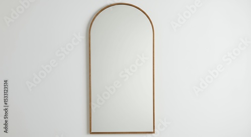 Arch mirror on light beige wall