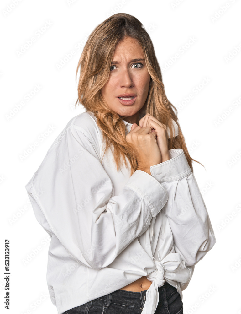 Caucasian blonde woman in studio scared and afraid. Caucasian blonde woman in studio scared and afraid.