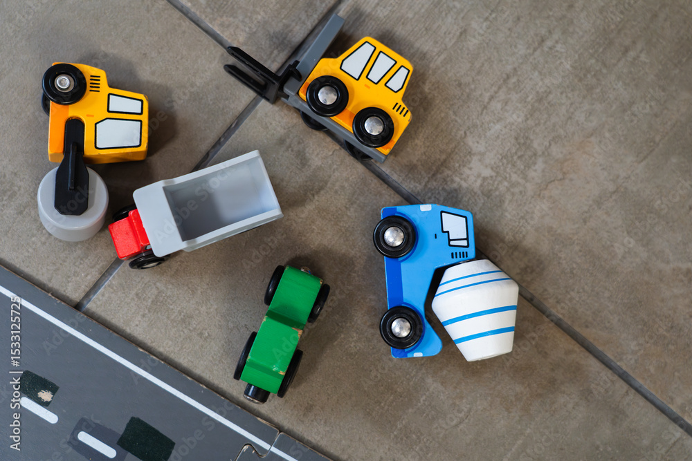 Obraz premium wooden construction toys next to a road on the floor at home