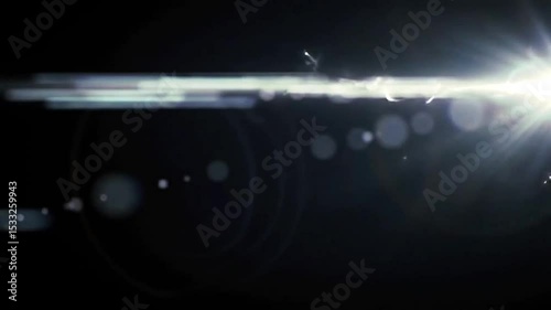 Intense lens flare streak moving horizontally over dark frame, minimal sci-fi look