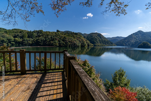 view of reservoir in mountain area from wood deck in Kumamoto prefecture, Japan.