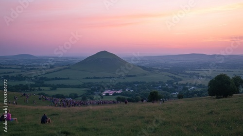 Sunset over a grassy hill
