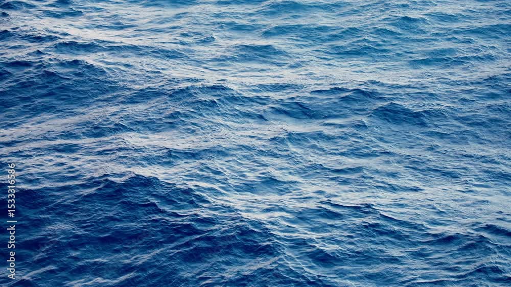 Gently rolling ocean waves captured in a serene blue color, showcasing natures beauty and tranquility. Perfect for relaxation and naturethemed projects Gently rolling ocean waves captured in a serene blue color, showcasing natures beauty and tranquility. Perfect for relaxation and naturethemed projects