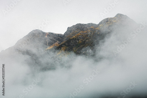 Mist covering mountains in the background
