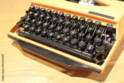 A close-up of vintage typewriter keys. Old keyboard in black and white. Letters of a typewriter. Vintage machine. Old technology.