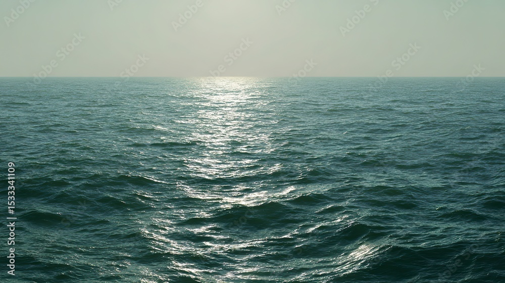 Obraz premium The calm sea, light blue-green tones, and the tranquil underwater view, where the sunlight reflects off the water's edge, creating a tranquil atmosphere. Gentle ripples and silence on the sea.